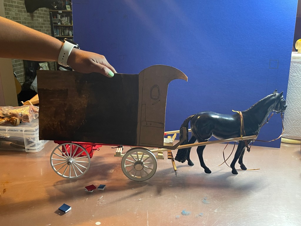 Breyer snowman with Breyer cart cutout. 