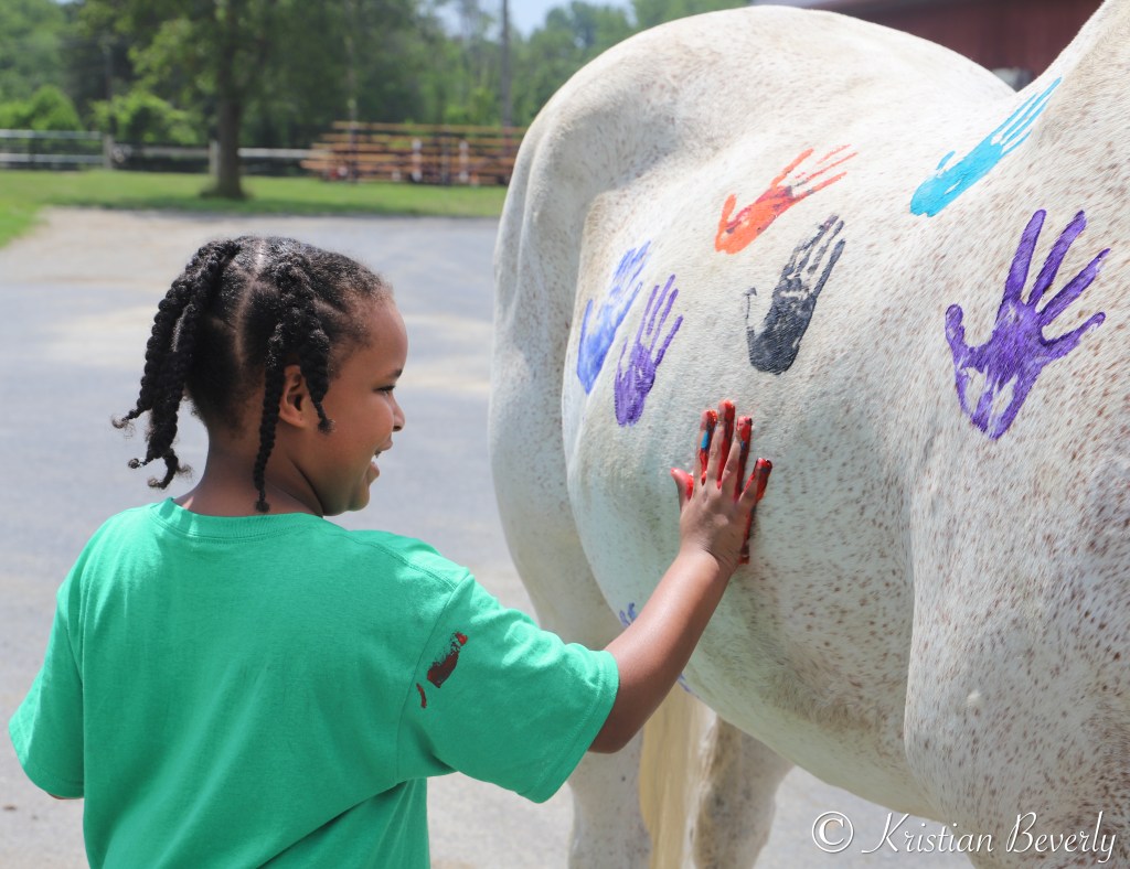 Girl paints real horse