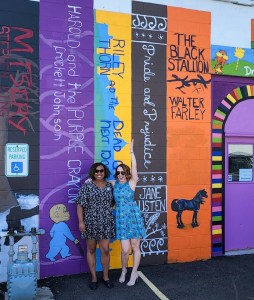 Kristian and Lucy Score in front of a book spine 